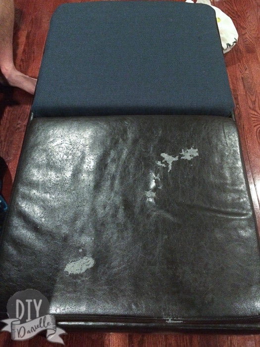 Comparison of the leather ottoman before (bottom) vs the after with new fabric.