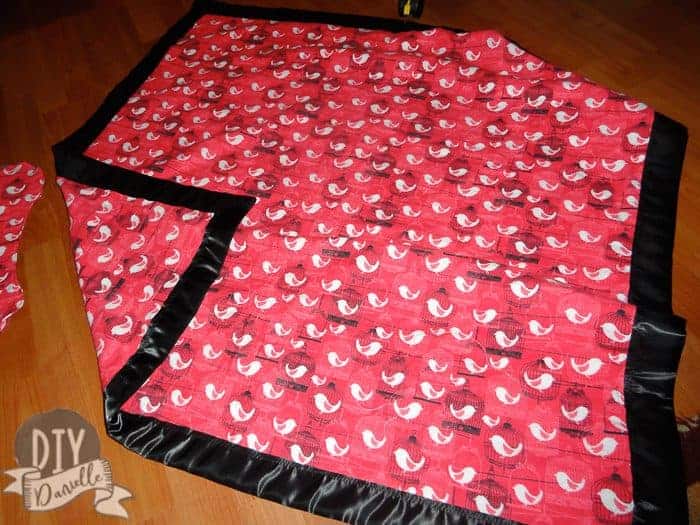 Over sized baby blanket made from flannel with satin binding. 