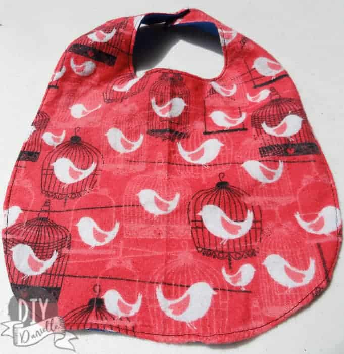 Pink and white birds on a DIY baby bib