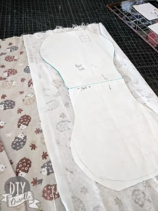 Cutting out my burp cloth pattern on flannel fabric. 