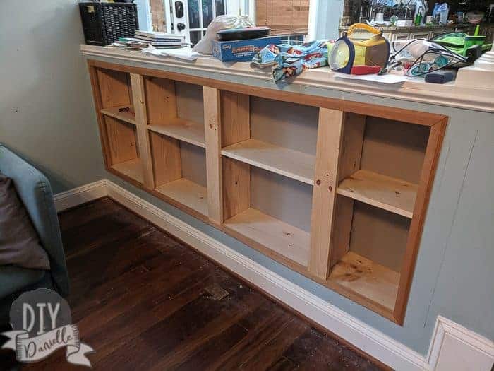 Trim added to frame the recessed shelving.