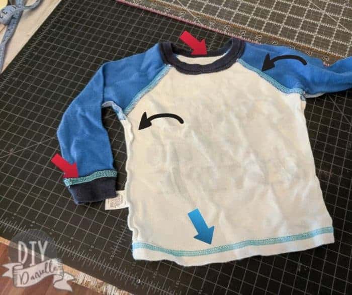 Picture of a raglan-style long sleeve shirt with arrows pointing to different areas that were sewn together.
