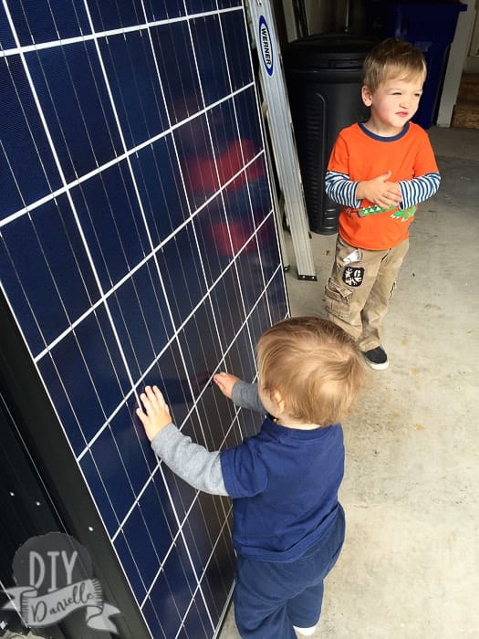 Kids touching the solar panels.
