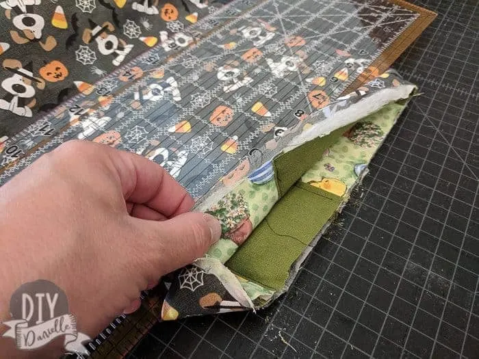 The Easter fabric pieces tucked wrong sides together with the Halloween fabric. 