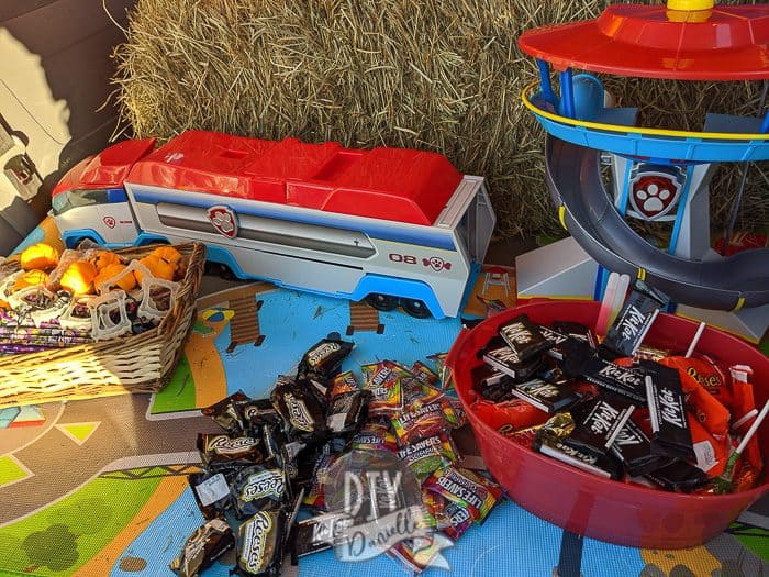 Halloween treats in our trunk. There's treats on left that are non edible- like vampire fangs (huge hit), squishy pumpkins, pencils, and erasers.