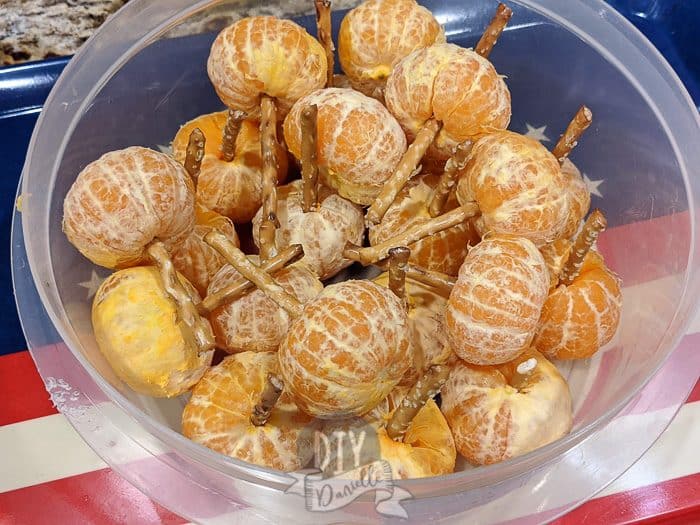 Orange pumpkins packed to go to school inside a reusable plastic container. 