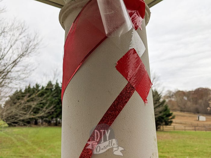 Red duct tape to stick the ribbon to the columns on front porch.