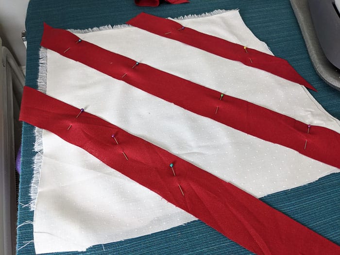Pinning the stripes in place to create a candy cane effect.
