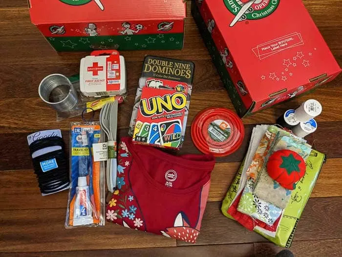Along with a sewing kit, I was able to fit Dominoes, hair ties, a shirt, a slinky, UNO cards, and other items in a box for a 10-14 year old girl.