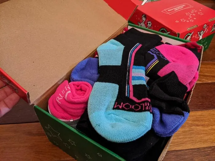 Socks in top of shoe box. 