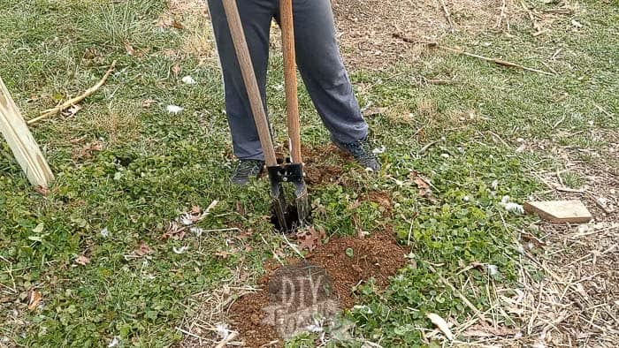 Closed handles on post digger as you shove it into the hole.