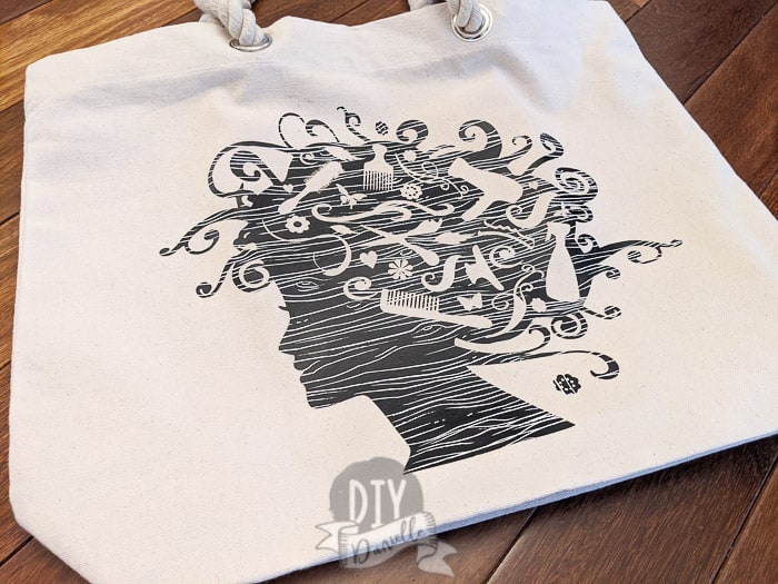 This woman's silhouette used a design I purchased on Etsy and Cricut patterned iron on.
