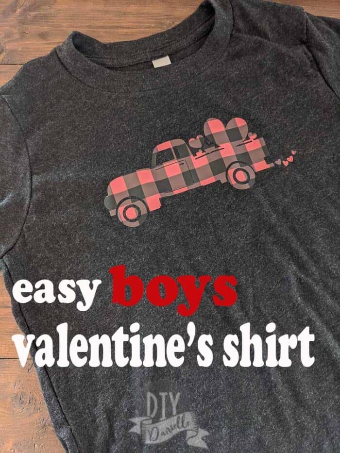 Easy boys Valentine's Day shirt with a truck in buffalo plaid with hearts on it. Placed on a black shirt.