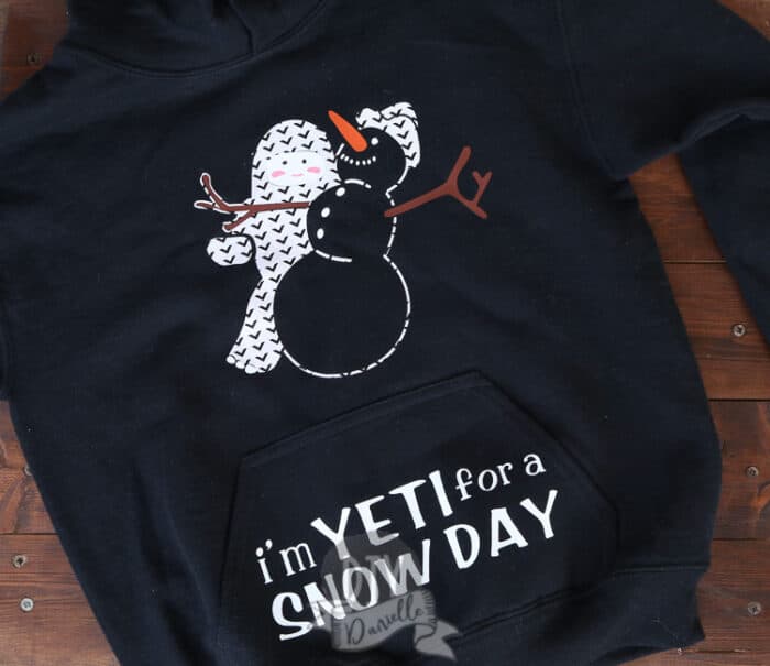 I'm Yeti for a Snow Day kids hoodie with a yeti holding a snow man.