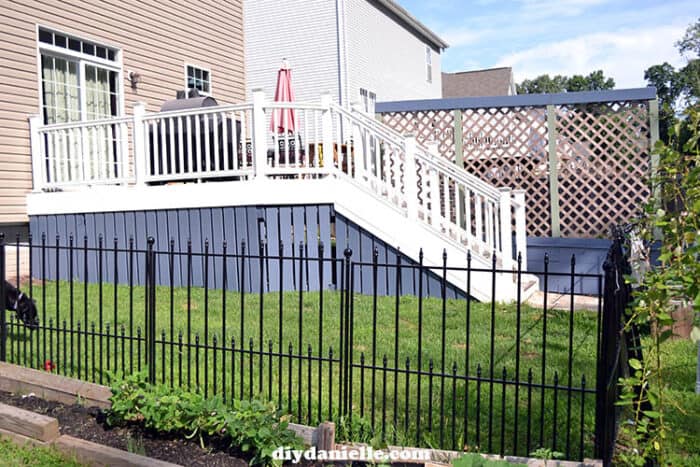 Photo of a high deck with a "skirt" (wood panels) around the bottom to hide under the deck. 