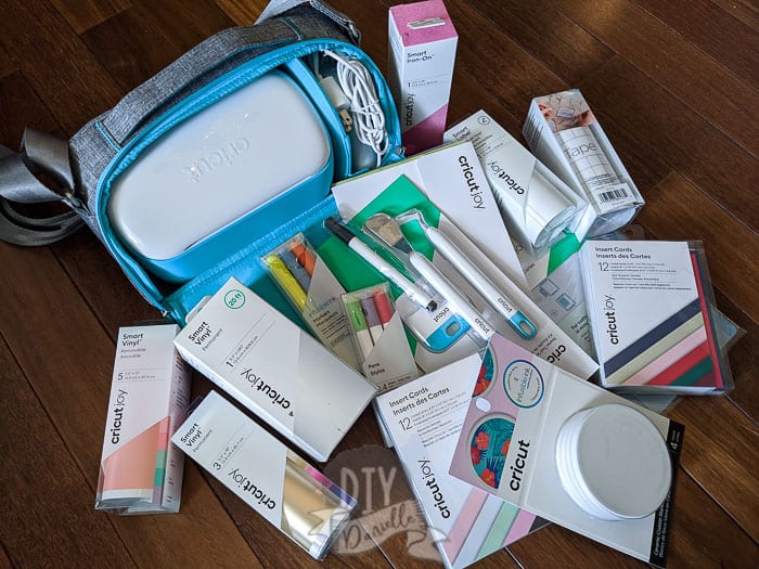 Supplies for Cricut Joy! Lots of Cricut Joy Smart Vinyl, pens, and other tools. Cricut Joy + special carrying case.