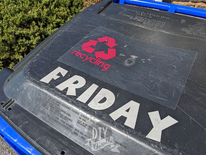 Recycling bin with a label for recycling AND for the day of the week the recycling is picked up.