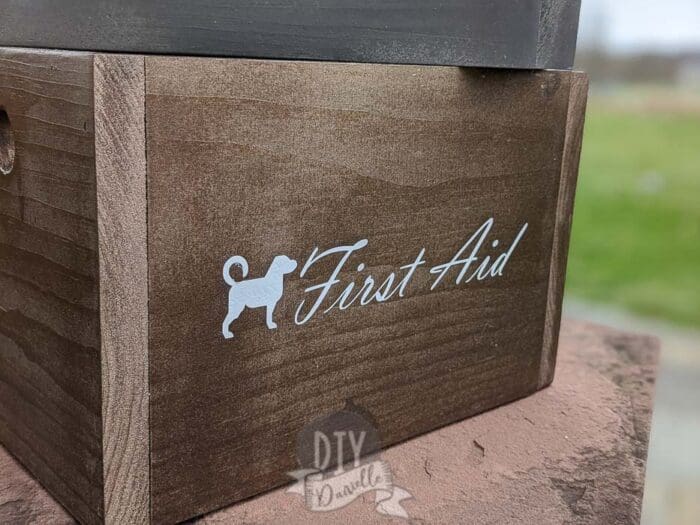 "First Aid" supply box for my dog that was labeled using white Cricut Iron On Vinyl.