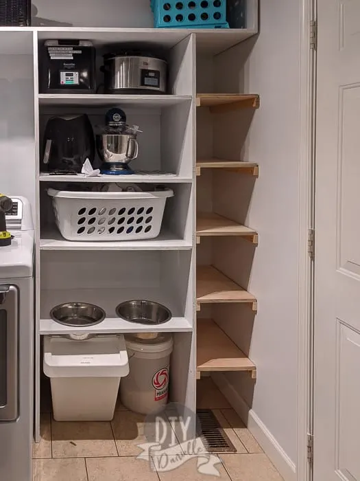 The pantry shelf on the left with appliances on it. The shoe shelf for the mudroom shelf on the right. 
