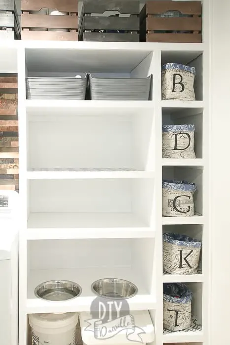 Left: DIY pantry shelf. This gives us a place to store small appliances and a spot to feed the dog below.
Right: This is a row of small baskets for socks. Each person's basket is marked with the first letter of their name. Shoes are hidden behind the basket.