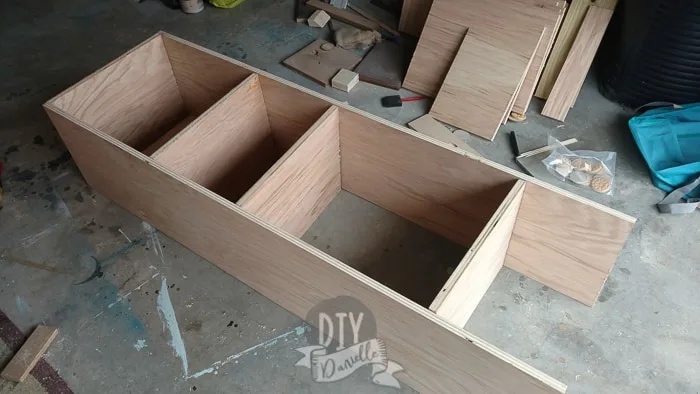 Shelves being built for either side of the seating bench.