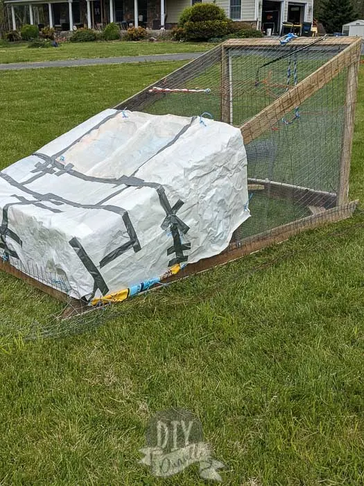 "Tarps" created with feed bags to cover the chicken tractor.