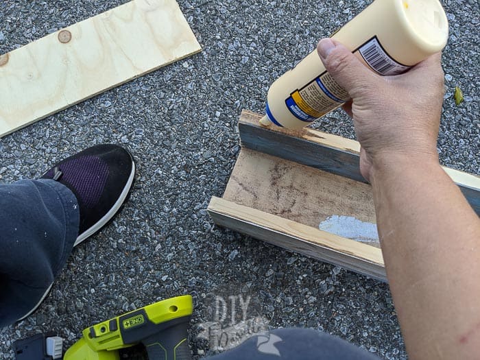 Gluing on the piece for the back of the dispenser.