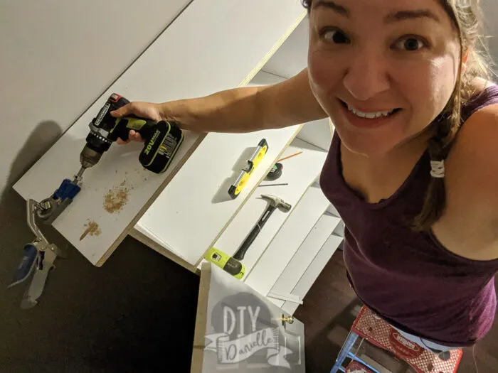 Me, adding pocket holes to the top shelf in my master closet!