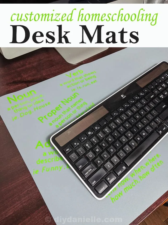 Customized homeschool desk mat that is under a keyboard. The 3rd grader's mat shows parts of speech and their definitions.