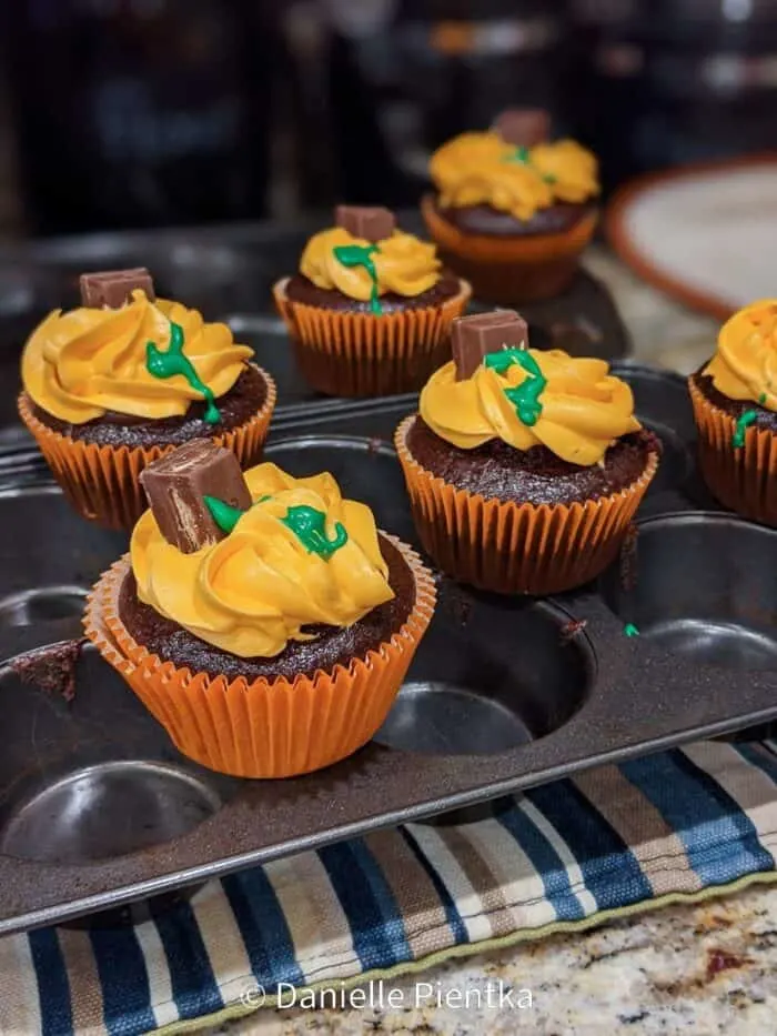 Pumpkin themed pumpkins for my son's birthday. These are chocolate cupcakes without egg because I'm allergic to eggs.