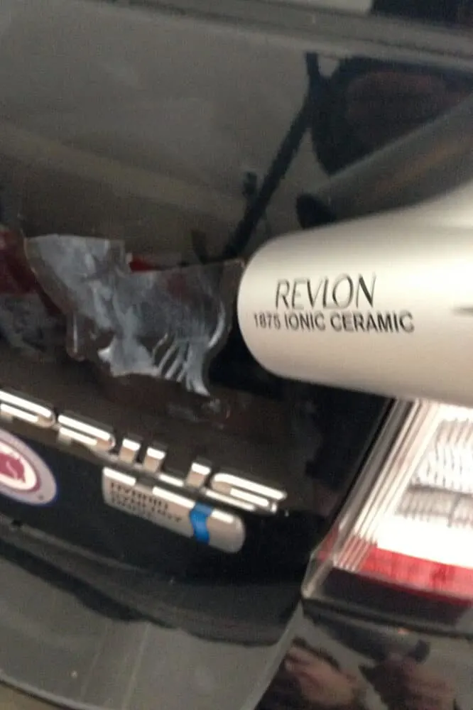 Using a hair dryer to remove the decal.