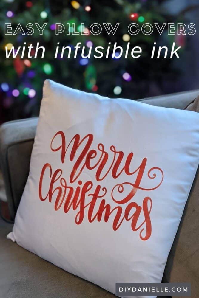 Easy pillow covers made with Cricut Infusible Ink: White pillow cover with Merry Christmas in red ink on it. Christmas tree in background.