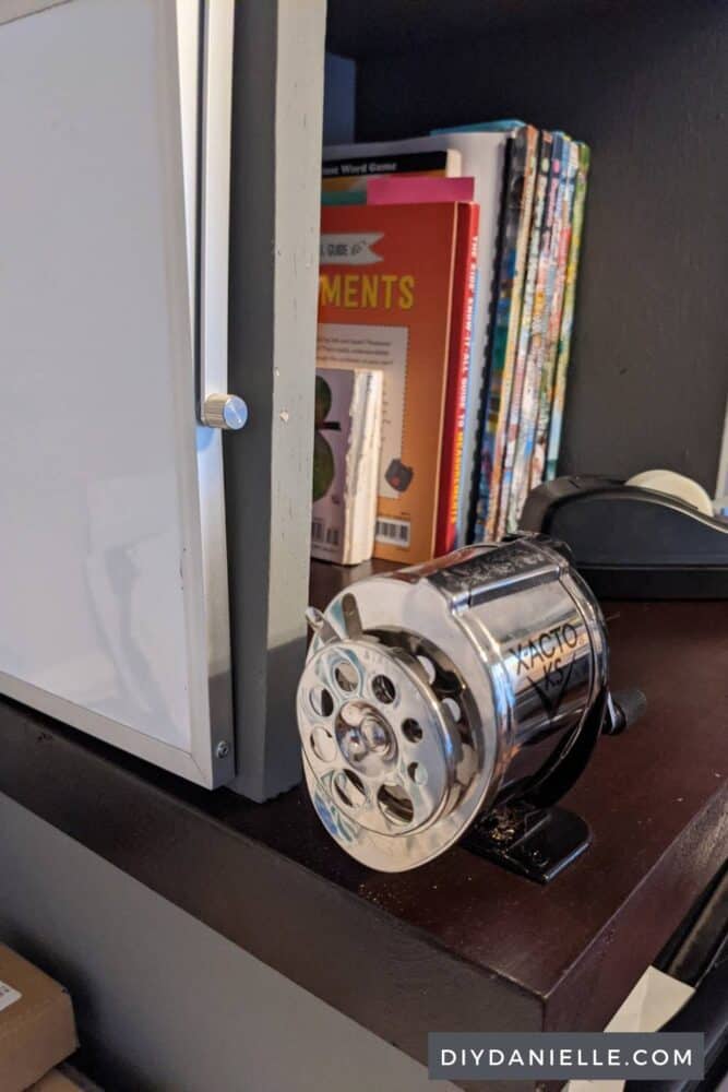 Pencil sharpener attached to the butcherblock counter for the printer stand.