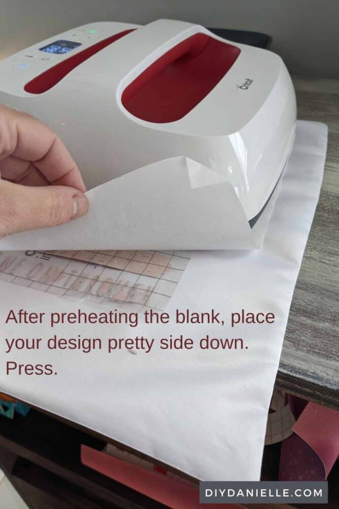 After preheating the blank, place your design pretty side down with butcher paper on top. Press.