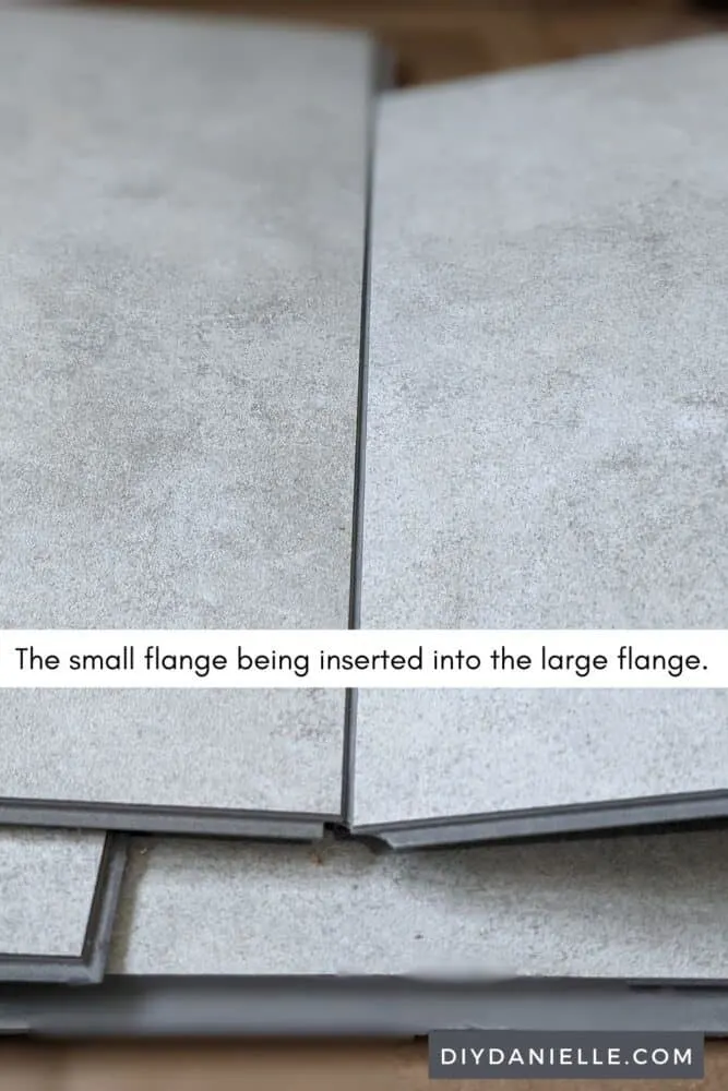 Dumawall Shower Panel: The right panel's small flange lines up with the left panel's large flange and they fit together.
