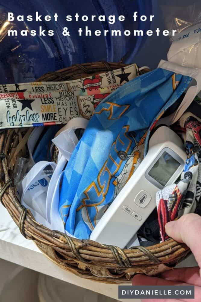 Basket with masks and a thermometer for storage. 