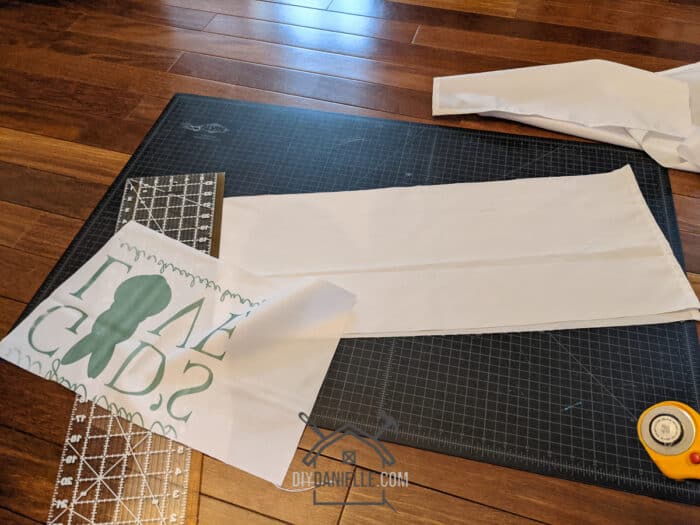 Cutting up the tablecloth I made a mistake on. It'll become a table runner and some napkins. 