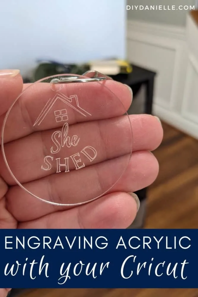 Acrylic keychain made with the Cricut Maker: The tag says "She Shed" and has a little roof/house above the words. Click to learn how to engrave acrylic tags with your Cricut Maker.