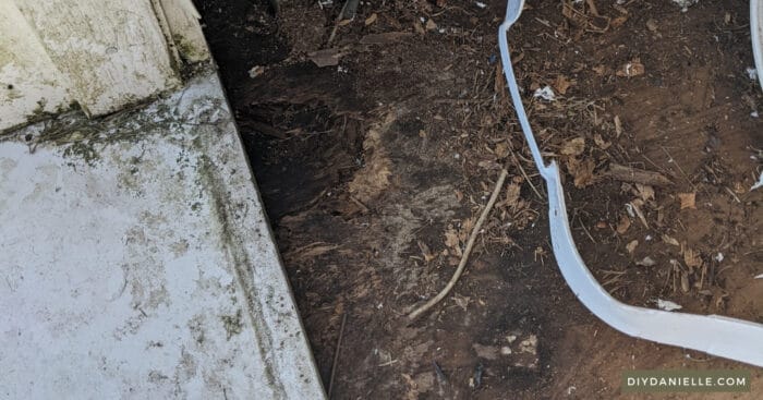 Corner of our shed floor that is rotten and starting to break through. This was caused by water leaking through the seam in the garage door.