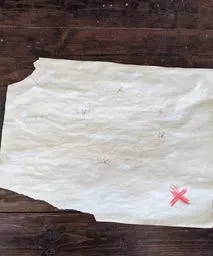 tea stained paper with kids drawing