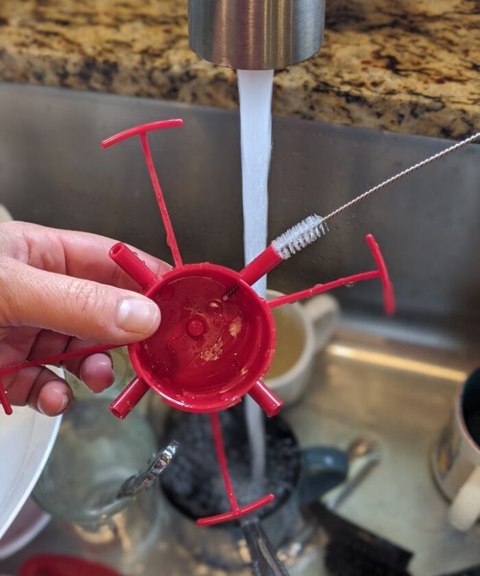 Tiny straw brushes work well to get into 
 and clean all the nooks and crannies of the hummingbird feeder.