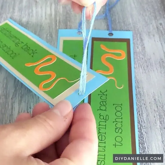 Creating the tassel: step 1

Pulling the loop through the hole at the top of the bookmark.