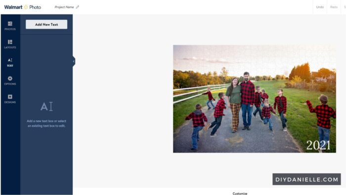 Editing the photo in Walmart's photo app to create the custom photo. I have a family photo from this year, and I added the text "2021" to the bottom right corner.
