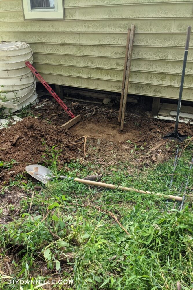 Digging up the spot where we wanted to place our hvac concrete slab.