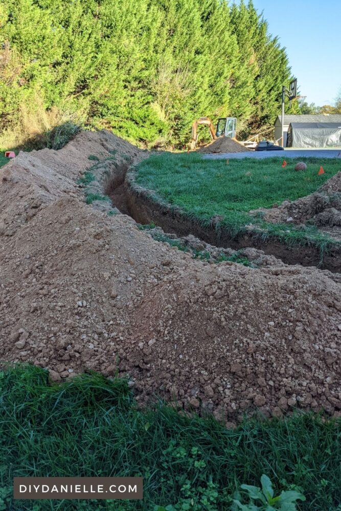 Photo of the trench being run for electric and water to our horse field and horse barn.