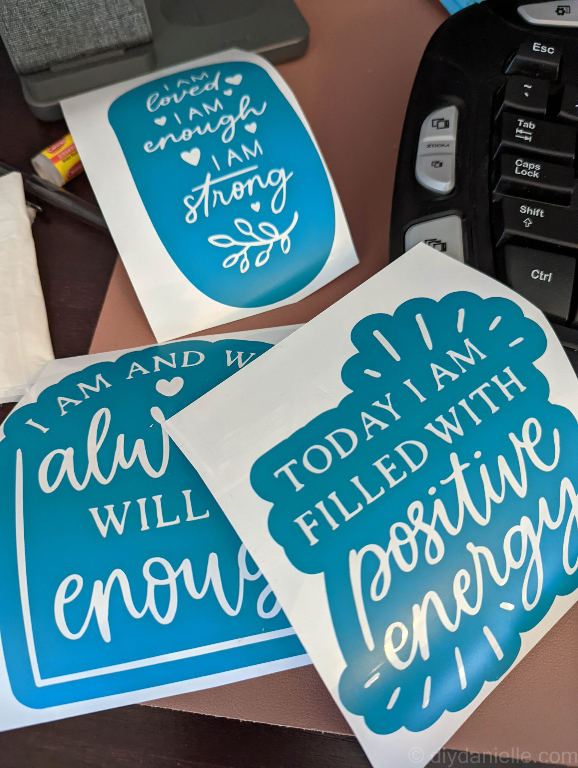Three vinyl stickers cut on the Cricut Maker 3 and weeded. These are affirmations that I'm adding to my mirrors.
