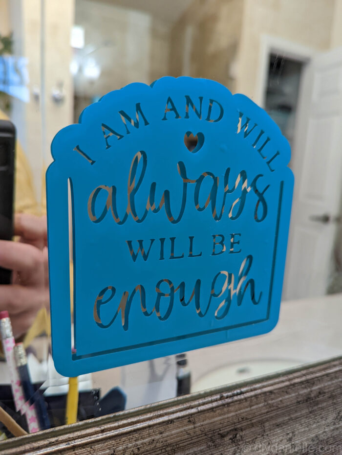 Affirmation: I am and will always be enough in permanent vinyl on a mirror.