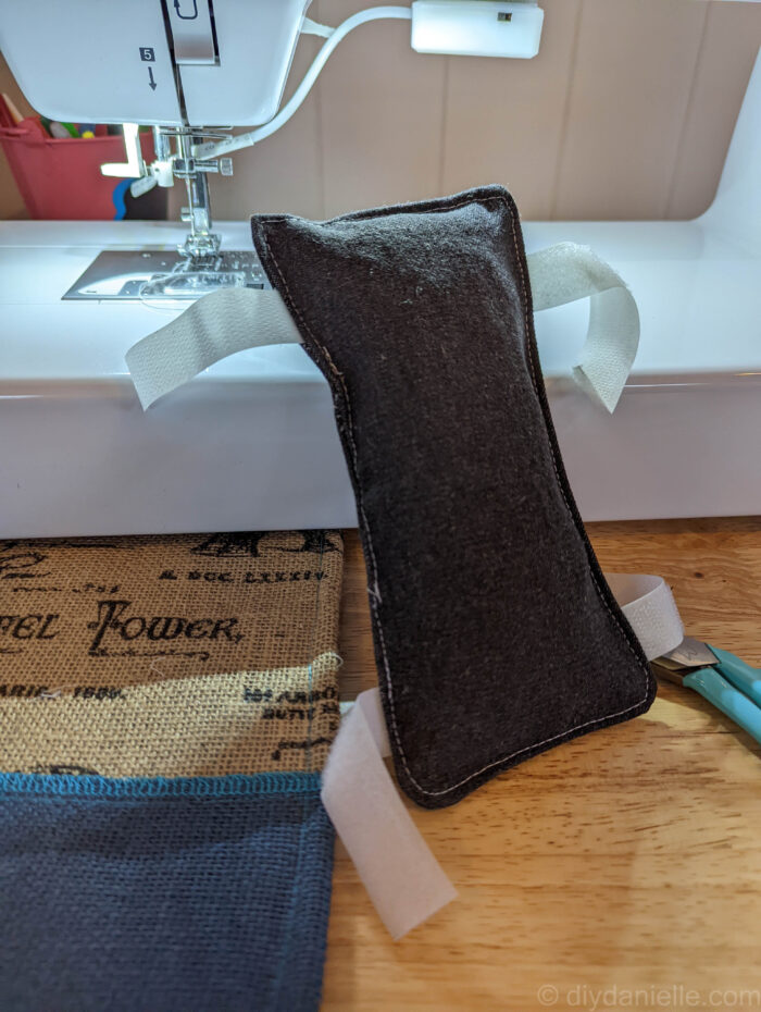 Port pillow, top stitched with hook and loop ready to attach to a seatbelt.