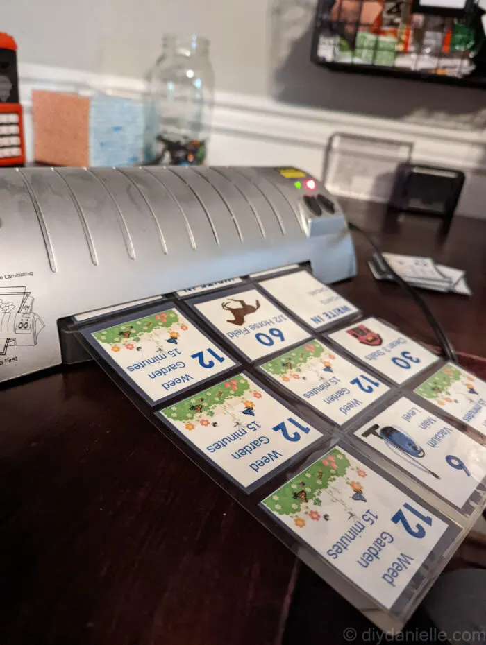 Laminating multiple chore cards at once.