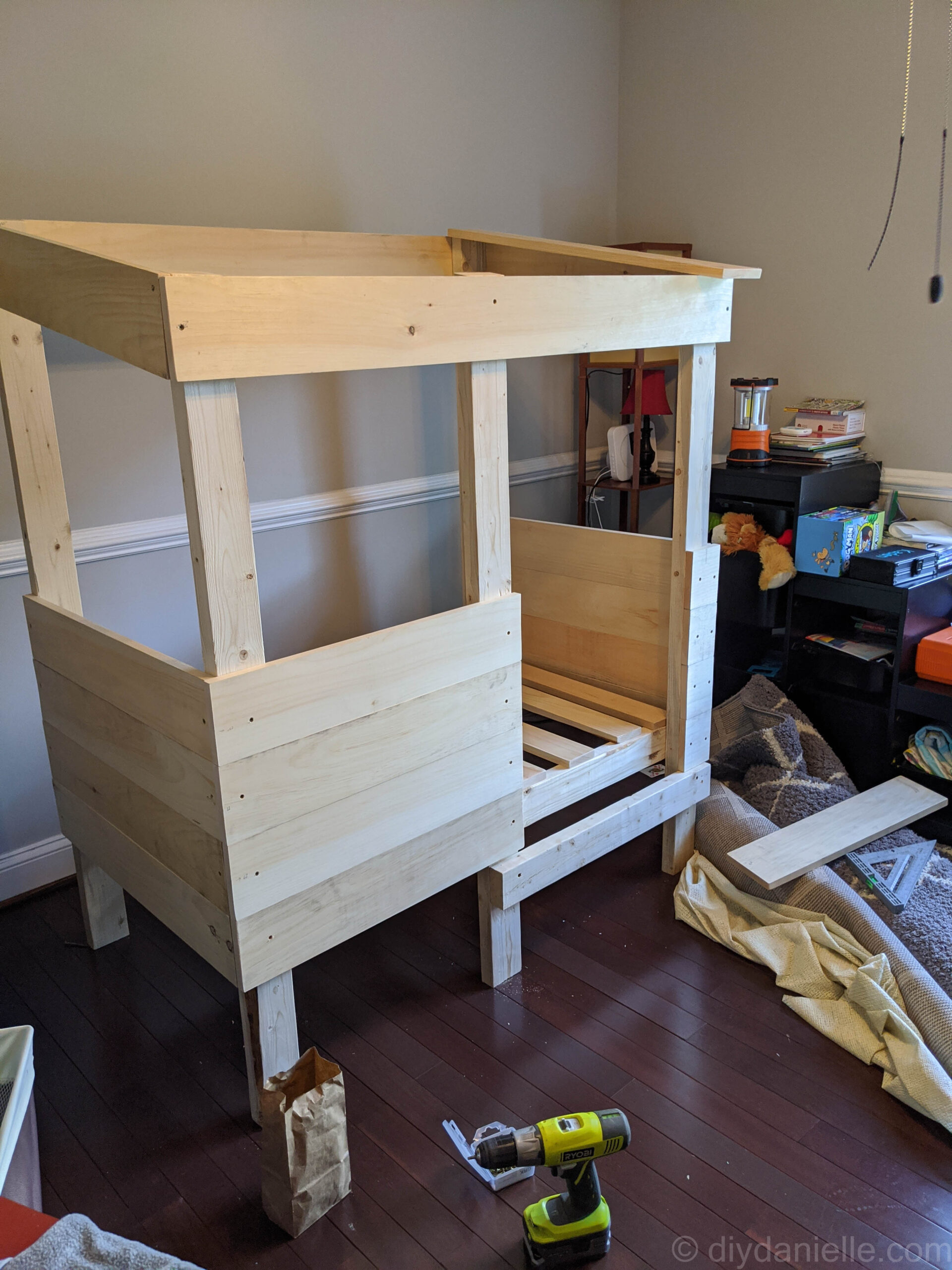 Adding the side pieces for the toddler bed.